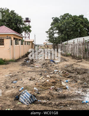 Trash fills a dirt road in Juba, capital city of South Sudan Stock Photo