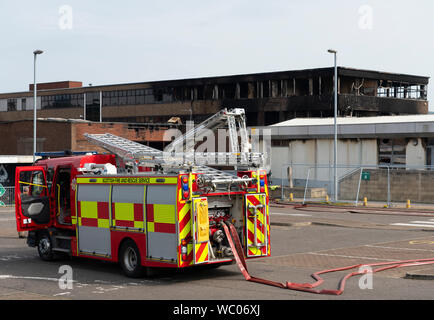Dunfermline, Fife, Scotland, UK. 27 August 2019. Scottish Fire Service remain at Woodmill High School in Dunfermline following a large fire at the school on Sunday, Today it was announced that the school will remain closed in the short to medium term and Council leaders and teachers are currently discussing a range of options for the pupils. A 14-year-old male was arrested and charged yesterday (Monday) in connection with the incident, and appeared at Dunfermline Sheriff Court today. Iain Masterton/ Alamy Live News. Stock Photo