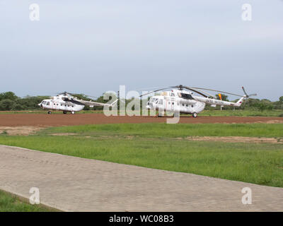 BOR, SOUTH SUDAN-JUNE 26, 2012: UN peacekeeping helicopters sit on the runway in Bor, South Sudan Stock Photo