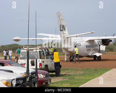 BOR, SOUTH SUDAN-JUNE 26, 2012: Workers load a UN plane with food aid in South Sudan Stock Photo