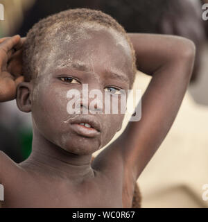 PANWEL, SOUTH SUDAN-NOVEMBER 2, 2013: Portrait of unidentified boy of the Dinka tribe in South Sudan Stock Photo