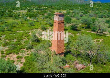 Aerial view of chimney or chacuaco of the sugar mill in El Gavilan Sonora. It is located around the country walk and ranch called El Gavilan, it is part of the Sonora River basin as it passes through the municipality of Hermosillo, Sonora Mexico. Sonora Desert. Sugar. old construction. Architect brick, landscape, rural, travel, (© Photo: LuisGutierrez / NortePhoto.com) Vista aerea de chimenea o chacuaco del ingenio azucarero en El Gavilan Sonora. Se encuentra en los alrededores del paseo campestre y rancho llamado el Gavilan, forma parte de la cuenca del Rio Sonora a su paso por el municipio d Stock Photo