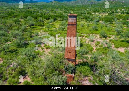 Aerial view of chimney or chacuaco of the sugar mill in El Gavilan Sonora. It is located around the country walk and ranch called El Gavilan, it is part of the Sonora River basin as it passes through the municipality of Hermosillo, Sonora Mexico. Sonora Desert. Sugar. old construction. Architect brick, landscape, rural, travel, (© Photo: LuisGutierrez / NortePhoto.com) Vista aerea de chimenea o chacuaco del ingenio azucarero en El Gavilan Sonora. Se encuentra en los alrededores del paseo campestre y rancho llamado el Gavilan, forma parte de la cuenca del Rio Sonora a su paso por el municipio d Stock Photo