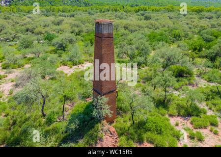 Aerial view of chimney or chacuaco of the sugar mill in El Gavilan Sonora. It is located around the country walk and ranch called El Gavilan, it is part of the Sonora River basin as it passes through the municipality of Hermosillo, Sonora Mexico. Sonora Desert. Sugar. old construction. Architect brick, landscape, rural, travel, (© Photo: LuisGutierrez / NortePhoto.com) Vista aerea de chimenea o chacuaco del ingenio azucarero en El Gavilan Sonora. Se encuentra en los alrededores del paseo campestre y rancho llamado el Gavilan, forma parte de la cuenca del Rio Sonora a su paso por el municipio d Stock Photo