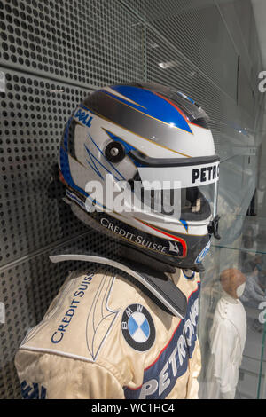 The helmet (with HANS device) belonging to BMW Sauber driver Nick Heidfeld on display in the BMW Museum, Munich, Bavaria, Germany. Stock Photo