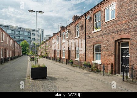 Traditional terraced houses on Anita Street in the Ancoats area of Manchester, UK. Stock Photo