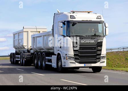 Turku, Finland. August 24, 2019. White Next Generation Scania R650 truck pulls gravel trailer on road test. Scania in Finland 70 years tour. Stock Photo