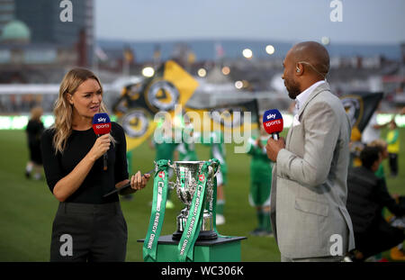 Sky Sports presenter Laura Woods with pundit Danny Gabbidon before the Carabao Cup Second Round match at Rodney Parade, Newport. Stock Photo