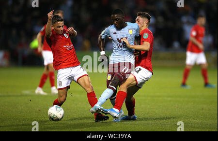 Aston Villa's Marvelous Nakamba (centre) is shown a yellow card by ...