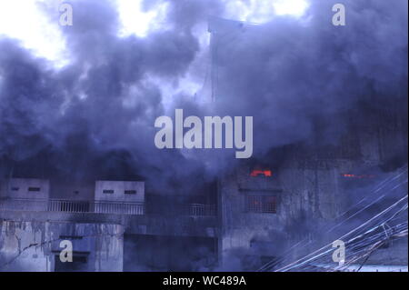 Smoke & flames billowing from a mattress factory fire, Steung Meanchey, Phnom Penh, Cambodia. credit: Kraig Lieb Stock Photo