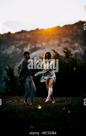 Young beautiful barefoot couple dancer practicing modern dance Stock Photo