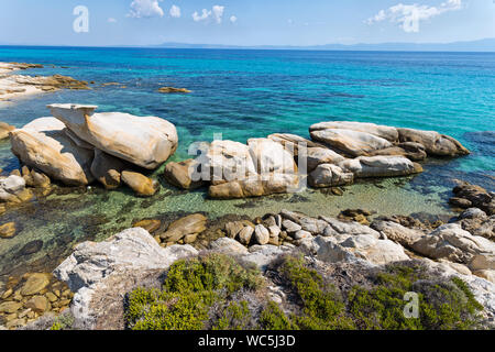 Exotic Platanitsi beach in Sarti, Sithonia, Greece with crystal clear water and spectacular shapes of rocks - the whale Stock Photo