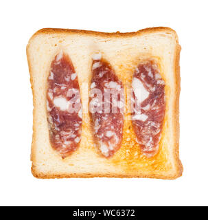top view of open sandwich with toast and three slices of cured sausage isolated on white background Stock Photo
