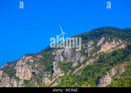 wind turbine installed on top of the mountain Stock Photo