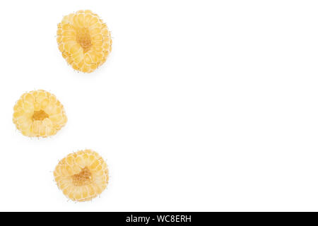 Group of three whole fresh golden hymalayan raspberry copyspace on right flatlay isolated on white background Stock Photo