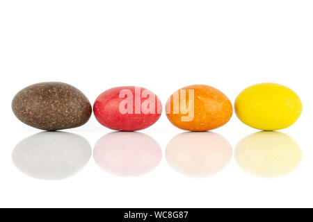 Group of four whole sugared nut dragee isolated on white background Stock Photo