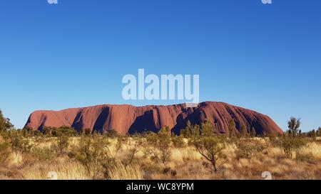 Uluru (previously known as Ayers Rock). The largest monolith in Australia and a sacred site for the local Pitjantjatjara Anangu aboriginal people. Stock Photo