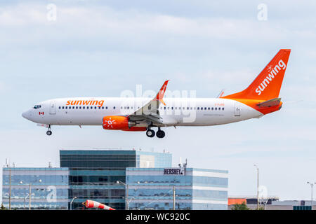 Sunwing Airline Boeing 737-800 landing at Toronto Pearson Intl. Airport. Stock Photo