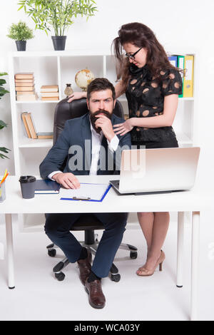 Experienced business affairs executives. Business professionals at work. Business couple working and communicating in office. Coworkers or managers leading informal business meeting. Stock Photo