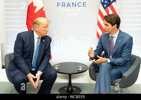 U.S. President Donald Trump with Canadian Prime Minister Justin Trudeau, right, prior to their bilateral meeting on the sidelines of the G7 Summit at the Centre de Congrés Bellevue August 25, 2019 in Biarritz, France. Stock Photo