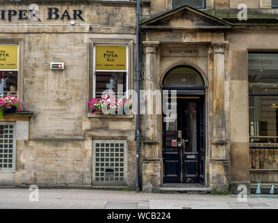 The Piper Bar on July 21, 2017 in Glasgow, Scotland. The Piper Bar is a popular pub and whisky bar across the street from George Square. Stock Photo