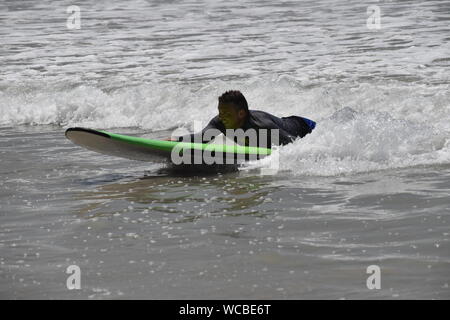 Surfing at Stinky's, Punta de Mita, Mexico Stock Photo