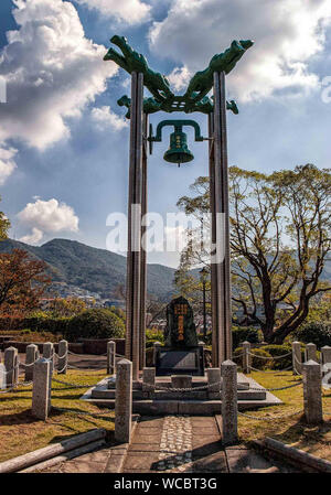 Nagasaki, Kyushu, Japan. 28th Oct, 2006. The Nagasaki Peace Bell is a memorial monument in The Nagasaki Peace Park in Japan. The park commemorates the World War II atomic bombing of the city, August 9, 1945, and is visited by many Japanese and foreign tourists. Credit: Arnold Drapkin/ZUMA Wire/Alamy Live News Stock Photo