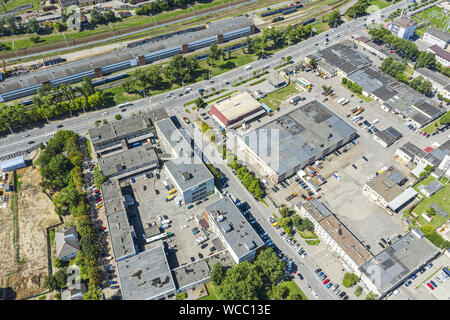 aerial top view of roofs of industrial buildings. manufacturing companies and factories at urban industrial area Stock Photo