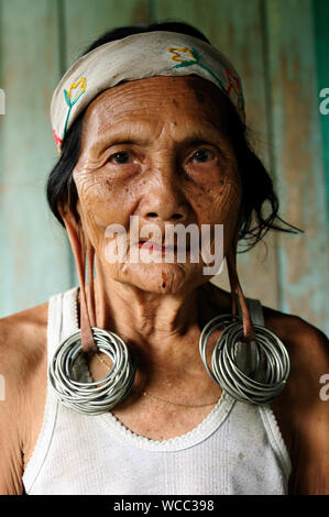 LONG BAGUN, BORNEO, INDONESIA - JULY 07: The older Dayak women with traditional long earlobes and tattoo from Borneo Stock Photo