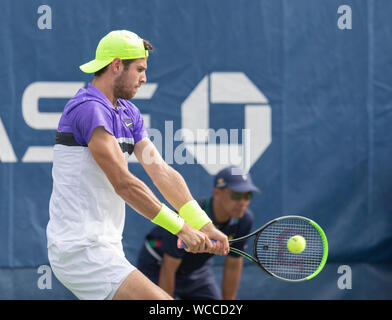 New York, NY - August 27, 2019: Karen Khachanov (Russia) in action during round 1 of US Open Tennis Championship against Vasek Pospisil (Canada) at Billie Jean King National Tennis Center Stock Photo