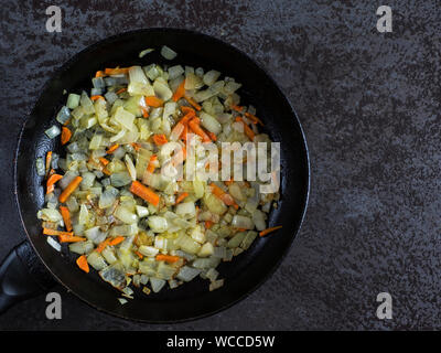 Directly Above Shot Of Cooked Onions And Carrots In Pan On Table