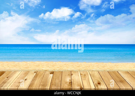 Wood table top on blue sea & sky background Stock Photo