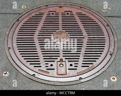 Pacific Gas and Electric PG&E Company high voltage manhole cover Stock Photo