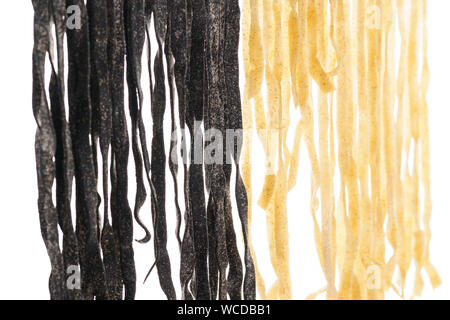 Various types of fresh homemade pasta. Raw pasta drying process. Isolated on white background. Stock Photo