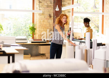 Two workers of publishing office working all day long Stock Photo