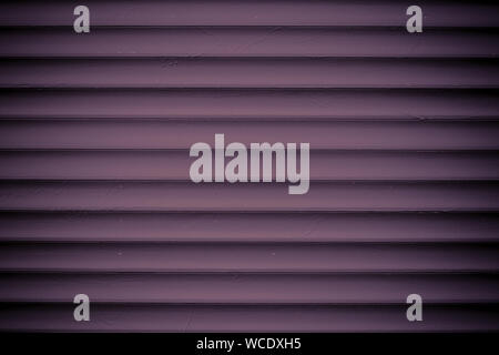 Texture of dark vinous metal jalousie. Ribbed red fence. Striped background. Modern backdrop. Burgundy slats. Abstract pattern of lines. Metallic surf Stock Photo