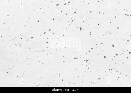Close-up of a white fiberglass (fibreglass) surface with dots in black and white. High resolution full frame abstract background. Copy space. Stock Photo