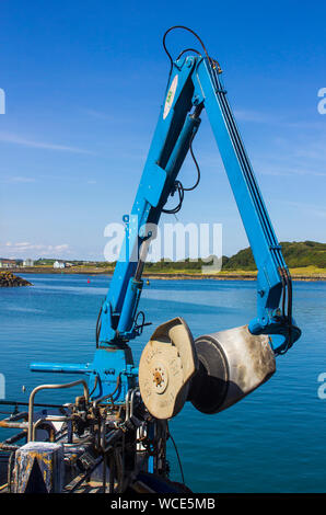 8 August 2019 A hydraulic flexible net boom arm on a small trawler berthed at Ardglass Harbour in County Down Northern Ireland Stock Photo