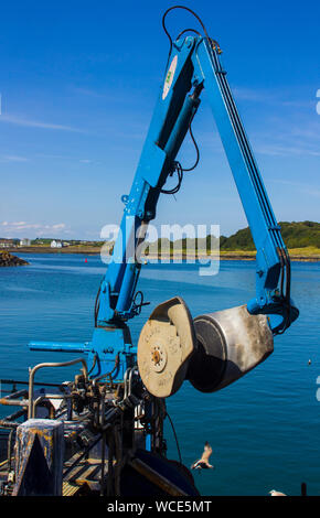 8 August 2019 A hydraulic flexible net boom arm on a small trawler berthed at Ardglass Harbour in County Down Northern Ireland Stock Photo