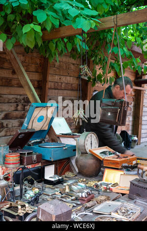 MOSCOW, RUSSIA - AUGUST 3, 2019: The wooden stalls of Izmailovsky market with the wide range of souvenirs, art and craft goods, antiques and others Stock Photo