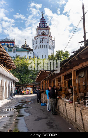 MOSCOW, RUSSIA - AUGUST 3, 2019: Izmailovsky Market. People shop at the artisan craft and souvenir market  selling Matrushka dolls and other Russian s Stock Photo