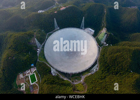 Pingtang. 27th Aug, 2019. Aerial photo taken on Aug. 27, 2019 shows China's Five-hundred-meter Aperture Spherical radio Telescope (FAST) in southwest China's Guizhou Province. China's FAST, the world's largest single-dish radio telescope, will greet the third anniversary of operation that began in September 2016. Credit: Ou Dongqu/Xinhua/Alamy Live News