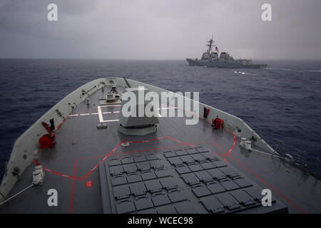 190823-N-LI768-1102  PEARL HARBOR (Aug. 23, 2019) – The Royal Australian Navy guided-missile destroyer HMAS Brisbane (DDG 41) sails with the U.S. Navy guided-missile destroyer USS Preble (DDG 88) during a cooperative deployment off the coast of Hawaii. Destroyer Squadron 31 staff and several Sailors embarked aboard Brisbane to learn about their shipboard operations and enhance the U.S. Navy partnership with the Royal Australian Navy. (U.S. Navy photo by Mass Communication Specialist 2nd Class Devin M. Langer) Stock Photo