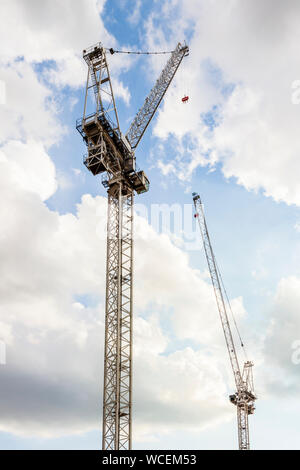 Two tower cranes against the sky, Nottingham, England, UK Stock Photo