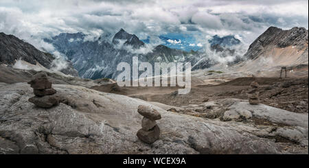 Stones cairn bridging gap near Zugspitze peak, Alps, Germany. Stock Photo