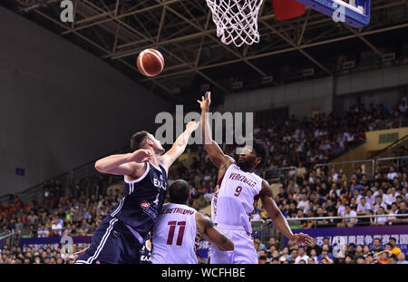 A basketball player of Greece, left, and a member of Venezuala, right, jump for a rebound during 2019 Suzhou International Basketball Challenge in Suzhou city, east China's Jiangsu province, 27 August 2019. Greece defeated Venezuela with 74-51 and wins the championship of 2019 Suzhou International Basketball Challenge in Suzhou city, east China's Jiangsu province, 27 August 2019. Stock Photo