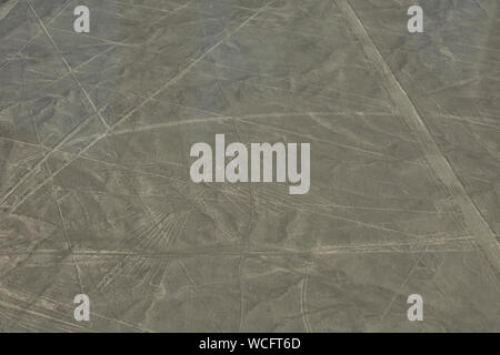 The Condor geoglyph figure in the peruvian coastal desert known as the mysterious Nazca Lines, Nazca City, Peru. Stock Photo