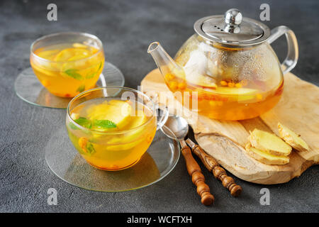 Tea set composition with hot tea on dark grey background Stock Photo