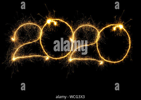 New Year 2020 arranged from sparking digits over black background Stock Photo