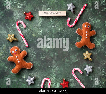Christmas background with felt gingerbread men Stock Photo